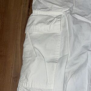 White parachute cargo pants. That tie at the bottom and top.